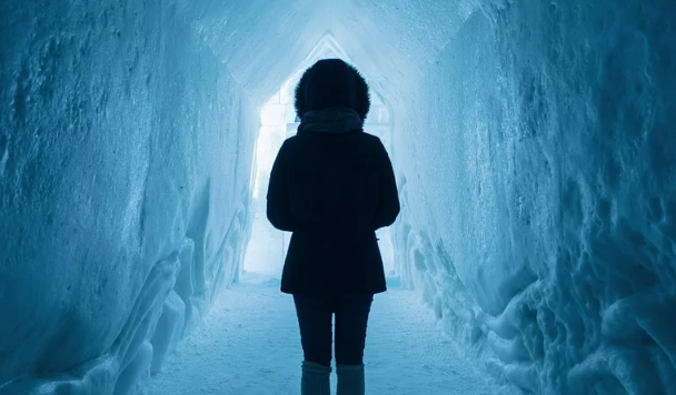 Woman cold tunnel light snow ice