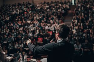 panel speaker at a crowd