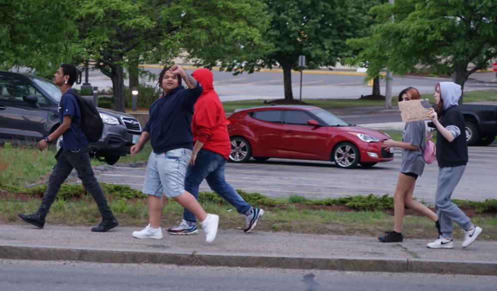 Young kid showing the Communist solidarity fist on way to BLM Vigil 'After Party'