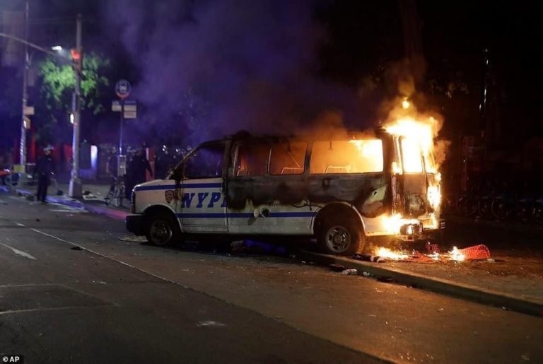 NYPD riots burning police vehicle