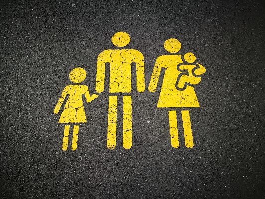 Family painted on pavement Photo by Sandy Millar on Unsplash