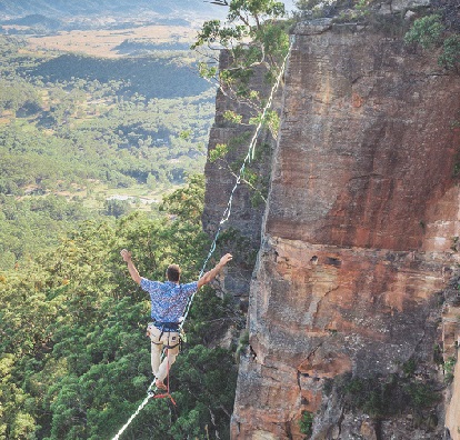 Risk man on tight rope loic-leray-O7Qq71Z7hwY-unsplash