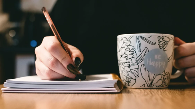 Pen writing notepad mug Photo by Lisa Fotios on Pexels