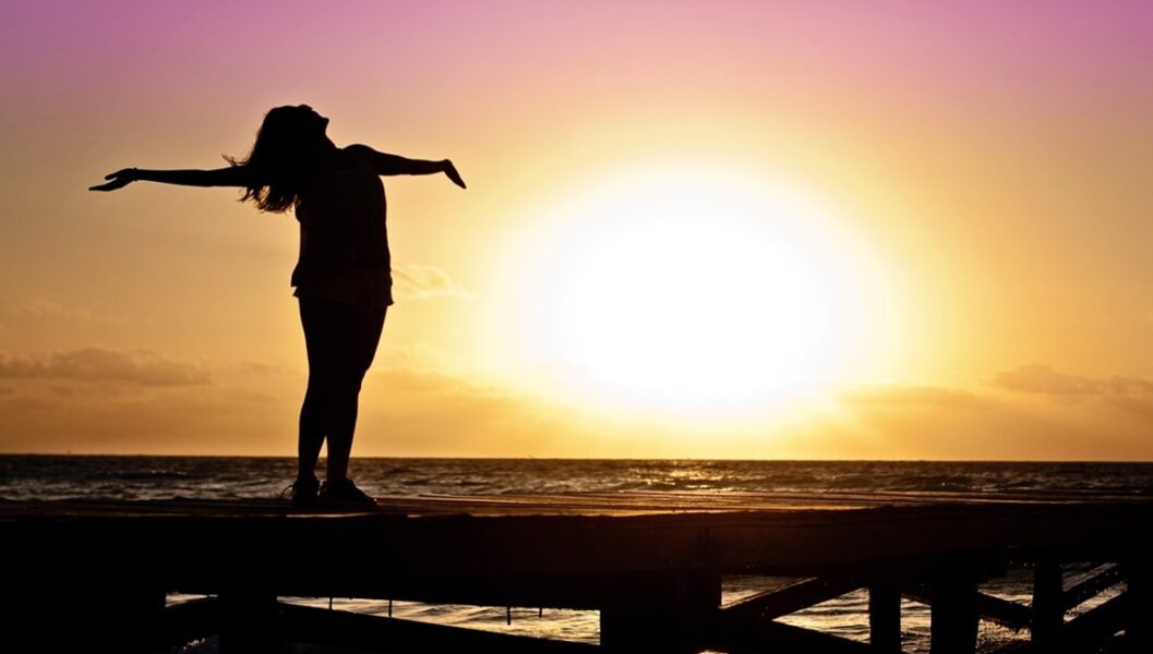 woman dock sunset