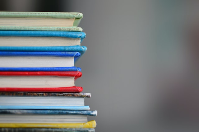 books stacked Photo by Kimberly Farmer on Unsplash