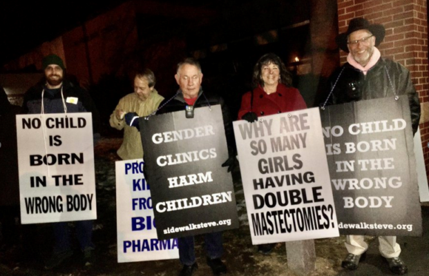 protest outside school baord meeting in Milford