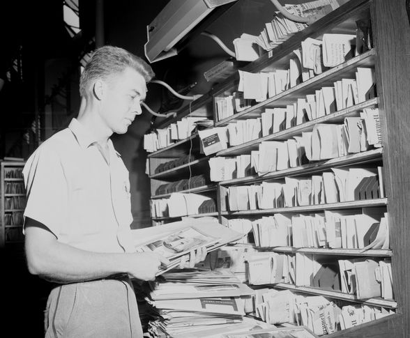 Unidentified postal clerk sorting mail at the Tallahassee Post Office PInterest